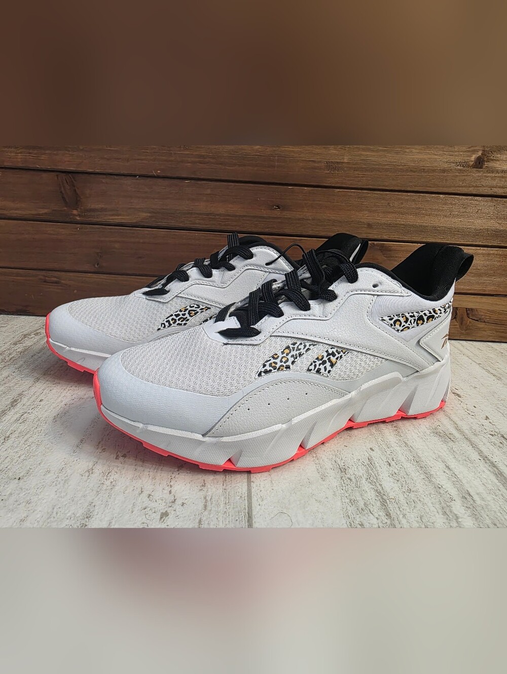 Reebok White Sneakers with Black Accents and Pink Soles